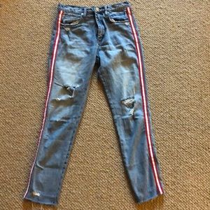 ripped light wash jeans with red stripe